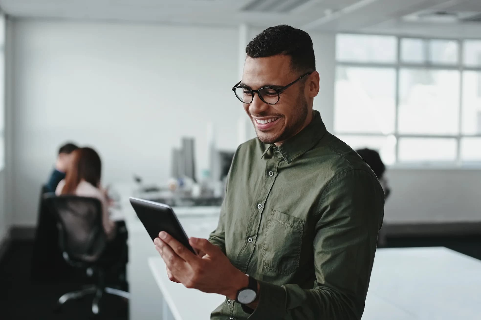 A man looking at a tablet